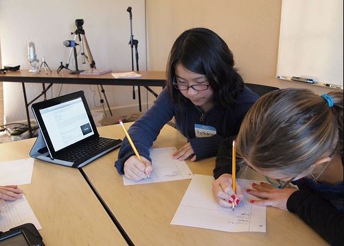 kids writing School children writing