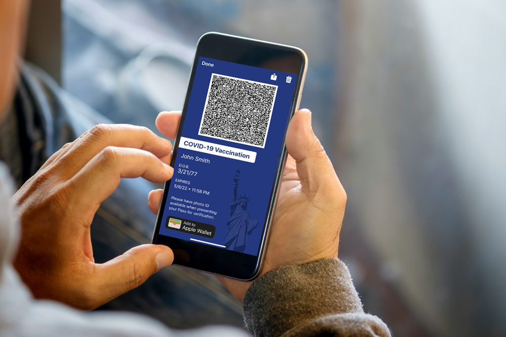 Young asian woman scanning QR code before enter a building